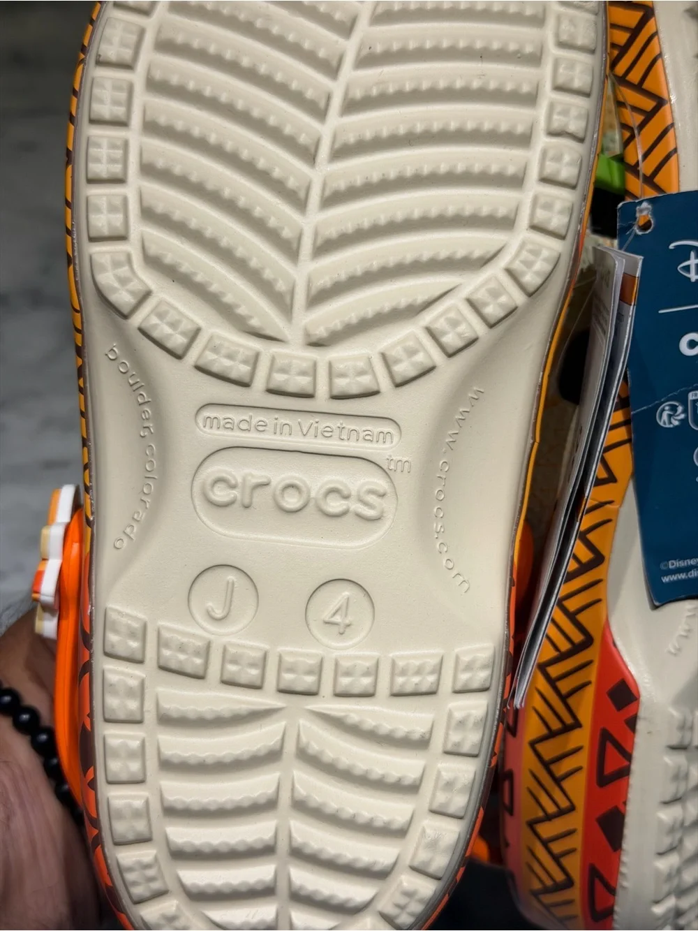 CROCS Kids Beige Orange Floral Moana Themed Clogs with Blue and orange Charms
